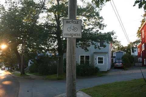 Sign on street promoting bicylcle awareness