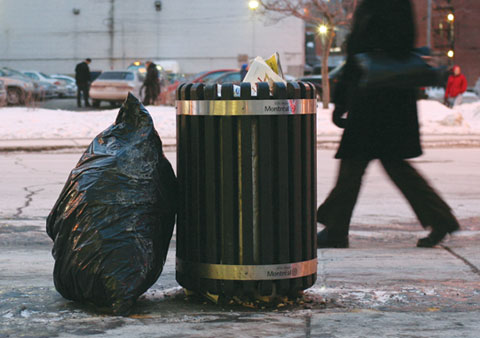 Garbage Can on Boulevard de Maisonneuve, Corner Rue Guy with walking people in the background