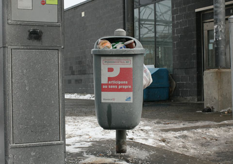 Garbage Can, which consists in a small grey container, on Boulevard Rosemont, Corner Rue St-Denis