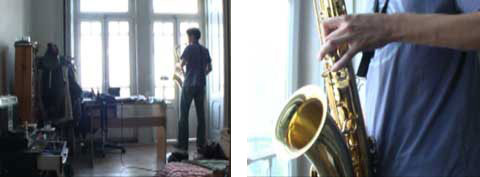 A young man standing in his room and playing the sax, from the documentary 'HomeSweetHome'.