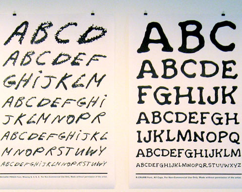 Two typography posters on gallery wall