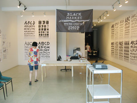 Gallery room with type posters on the wall