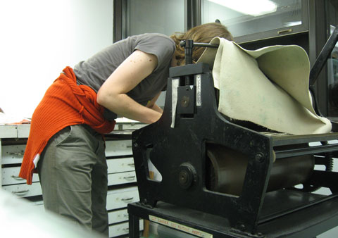 Brigitte working on etching press