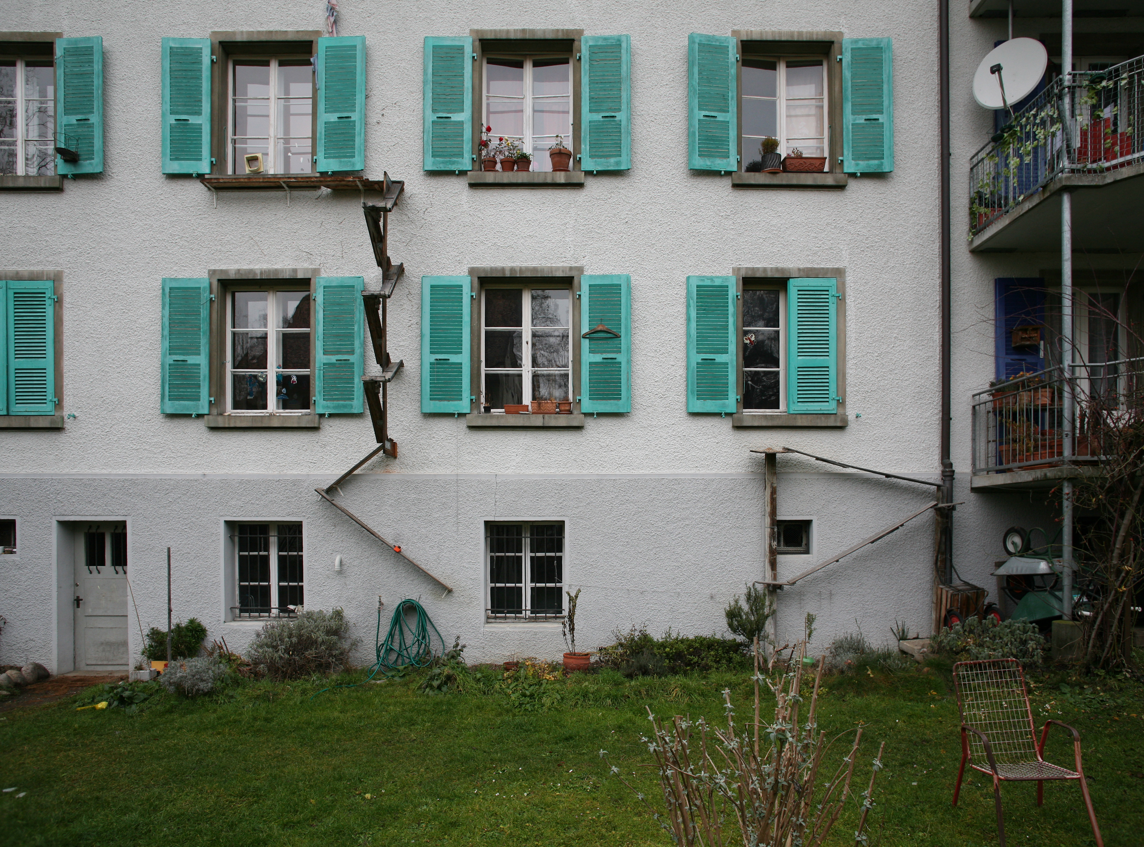 House front with two different models of cat ladders