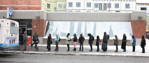 People waiting for the bus at Bus stop #460/202, Metro Station Du College, Montreal on February 9 2007