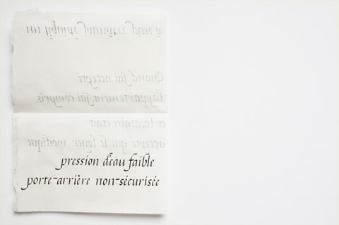 Sheet folded in half with calligraphic writing